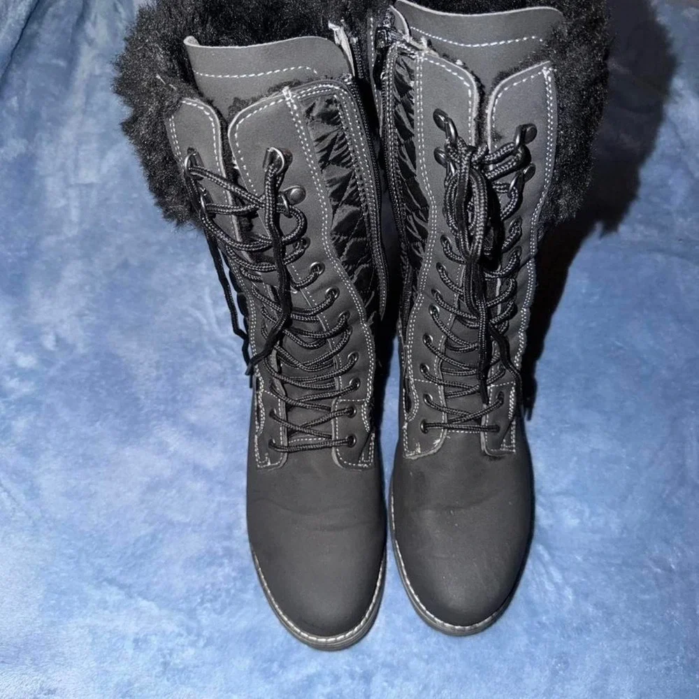 Black lace up winter boots with fur trim. Size: US 9